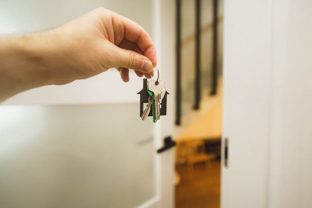 person-holding-house-keys